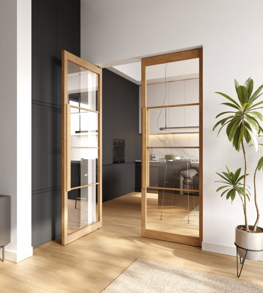 Zwei geöffnete Holztüren mit Glasfüllung führen in eine moderne Küche mit schwarzen Schränken und Holzfußboden. Zwei geöffnete Holztüren mit Glasfüllung führen in eine moderne Küche mit schwarzen Schränken und Holzfußboden.