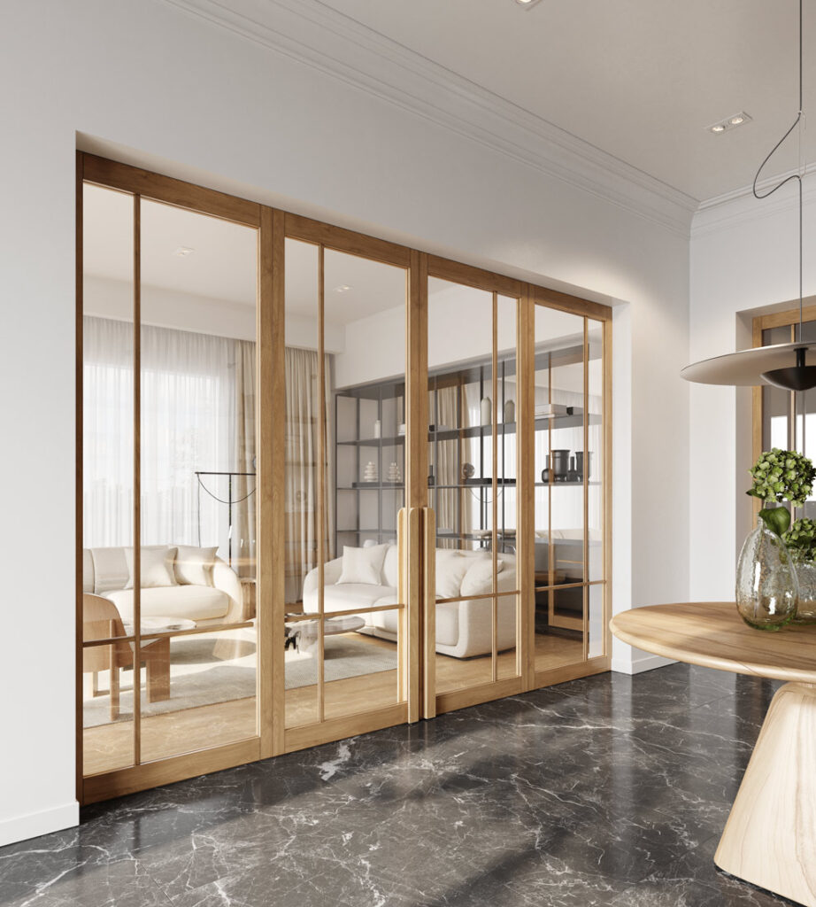 Große Schiebetüren aus Holz mit Glasfüllung trennen einen Wohnraum mit weißen Sofas und Regalen von einem Flur mit dunklem Marmorboden. Große Schiebetüren aus Holz mit Glasfüllung trennen einen Wohnraum mit weißen Sofas und Regalen von einem Flur mit dunklem Marmorboden.